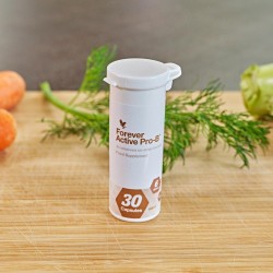 Forever Active Pro-B - Flacon de complément probiotique avec des légumes en arrière-plan